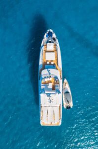 Aerial view of beautiful luxury yacht and boat in blue sea